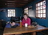 Ecuador Chimborazo 03-05 Peter Ryan and Charlotte Ryan Inside Carrel Refuge Having tea Peter Ryan and Charlotte Ryan stopped at the Carrel Refuge (4800m) and had some tea.